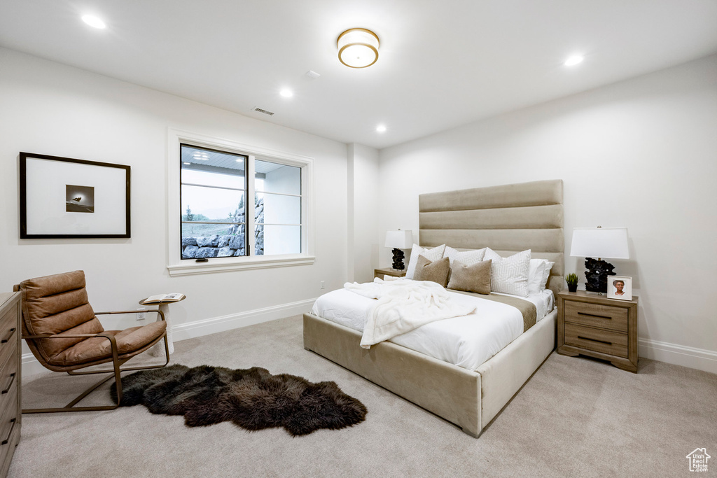 Bedroom featuring light colored carpet, recessed lighting, and baseboards