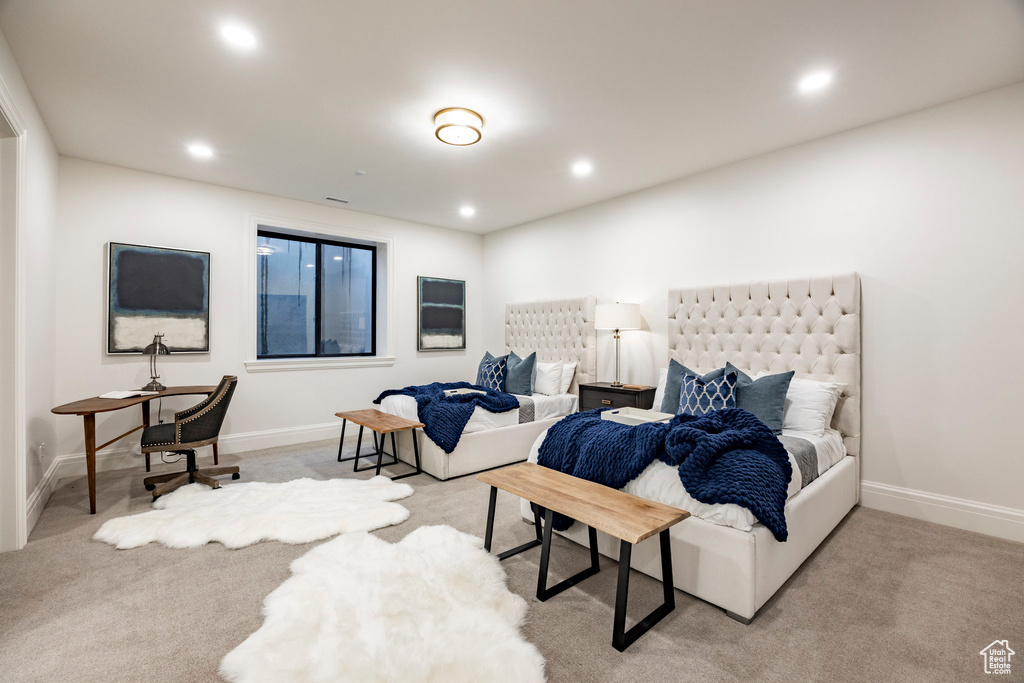 Carpeted bedroom with recessed lighting and baseboards