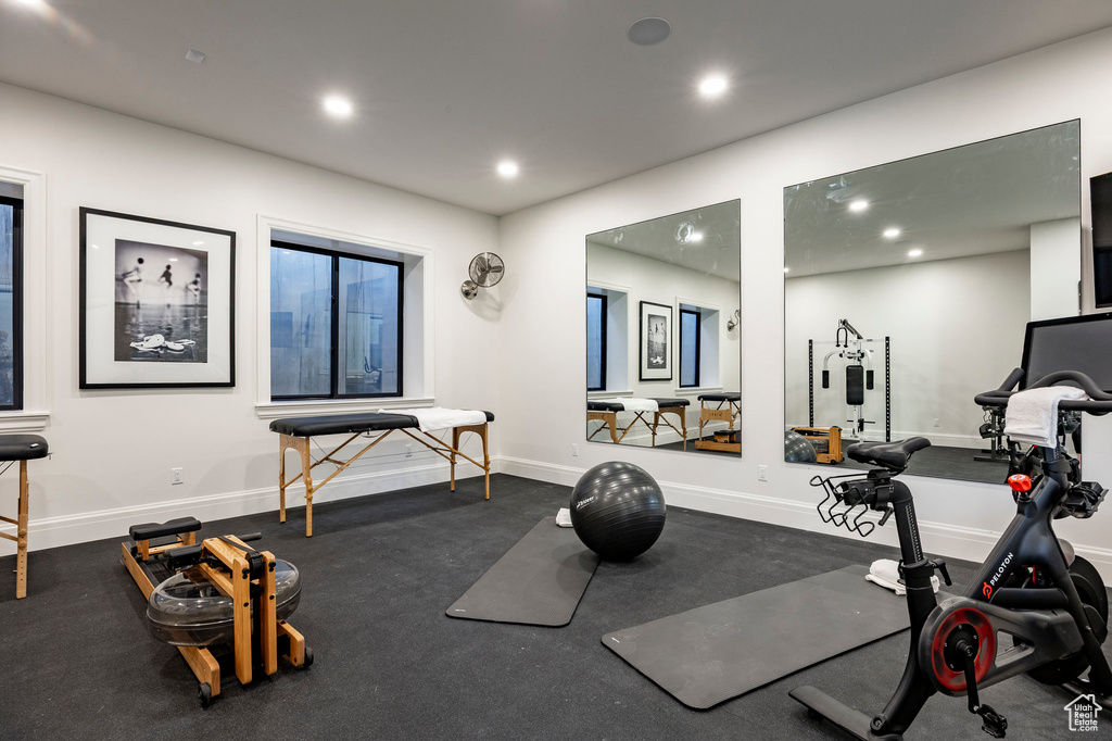 Workout room with recessed lighting and baseboards