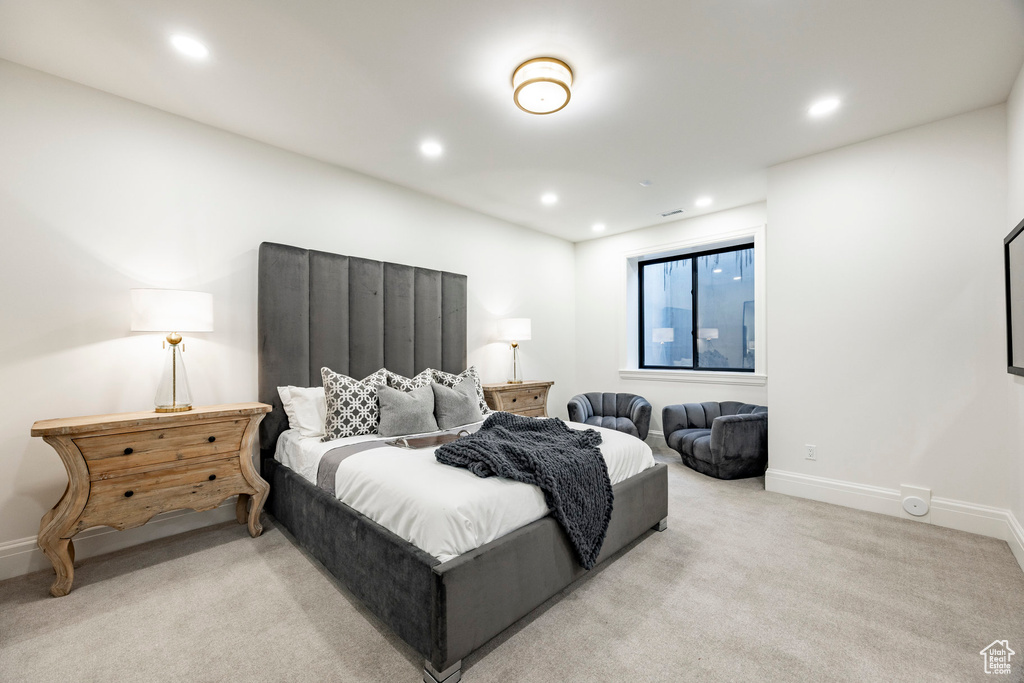 Bedroom featuring light colored carpet, recessed lighting, and baseboards