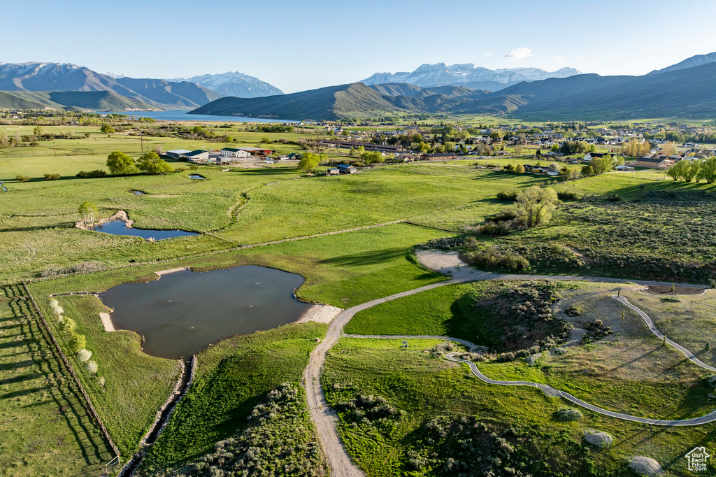View of property location with a water and mountain view and rural landscape