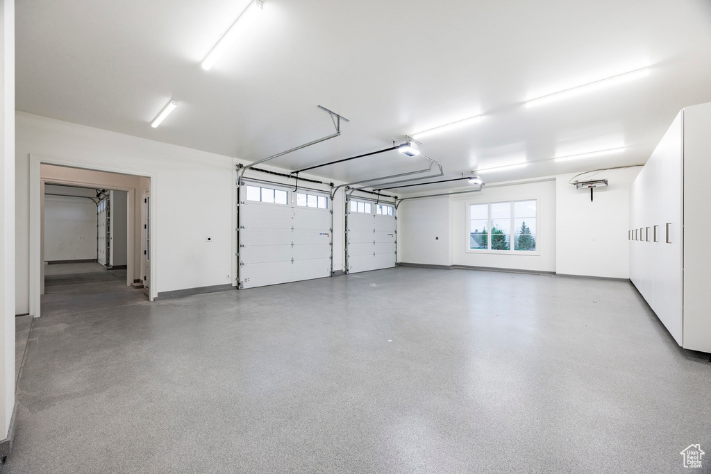 Garage featuring baseboards