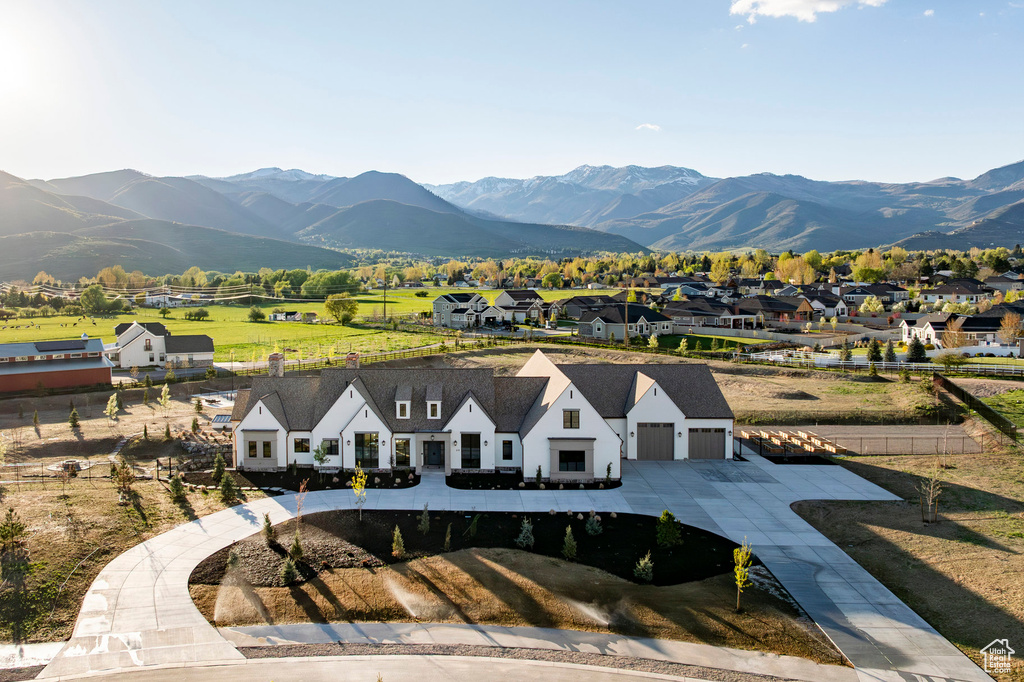 Aerial view of residential area featuring mountains