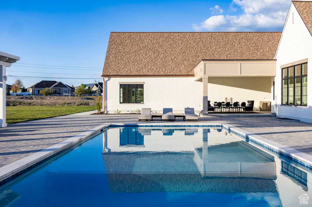 Outdoor pool featuring a patio