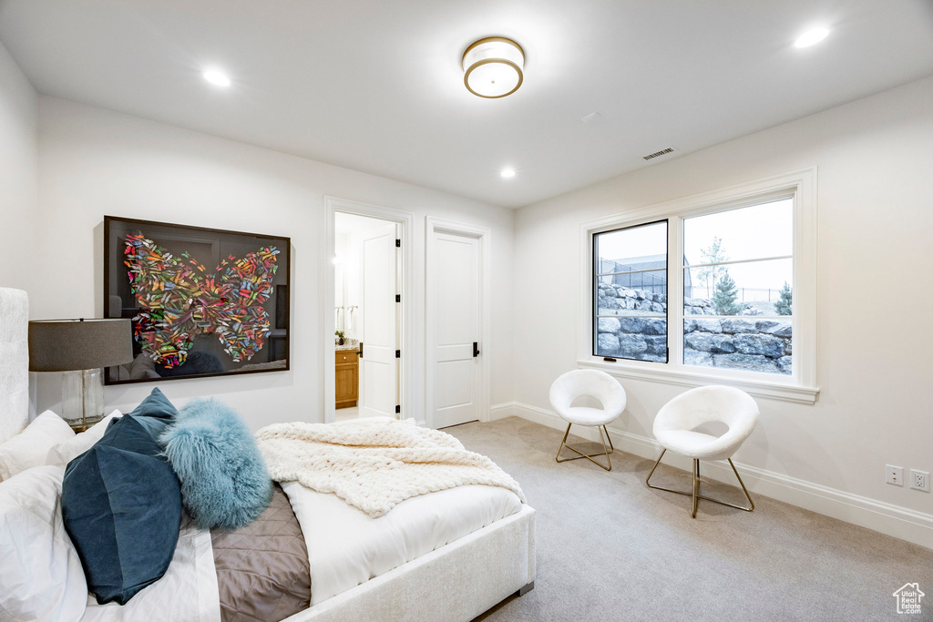 Carpeted bedroom with baseboards, recessed lighting, and ensuite bathroom
