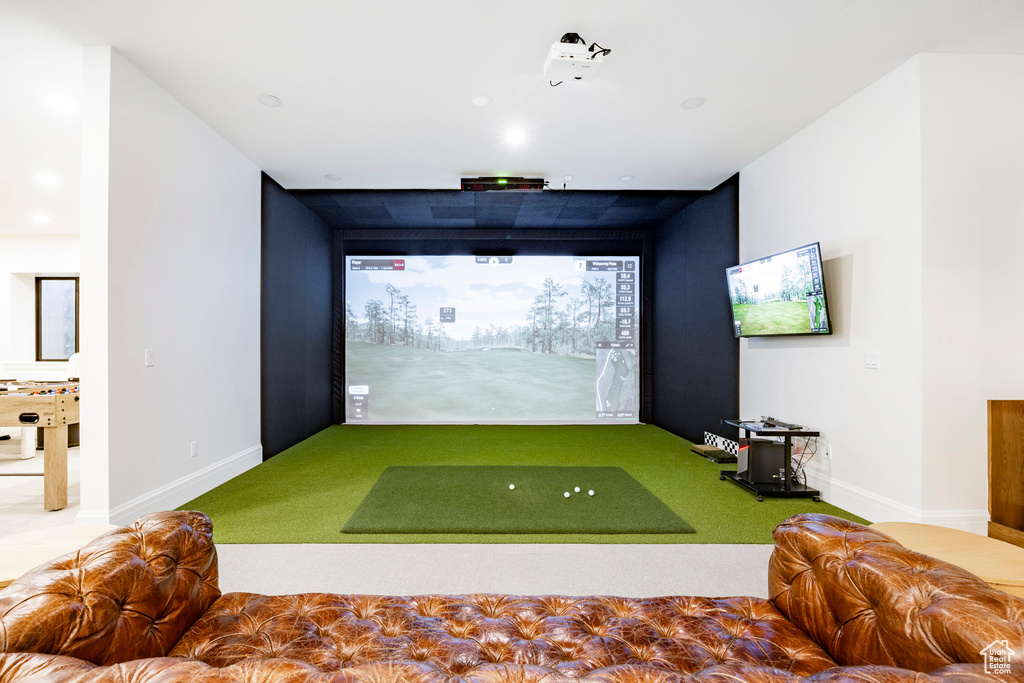 Playroom featuring golf simulator, baseboards, and carpet floors