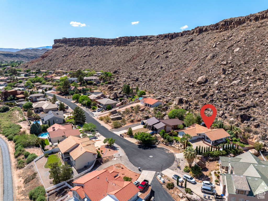 Aerial view of residential area with a mountainous background