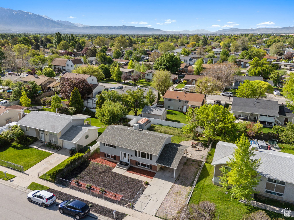 Aerial perspective of suburban area with a mountain backdrop