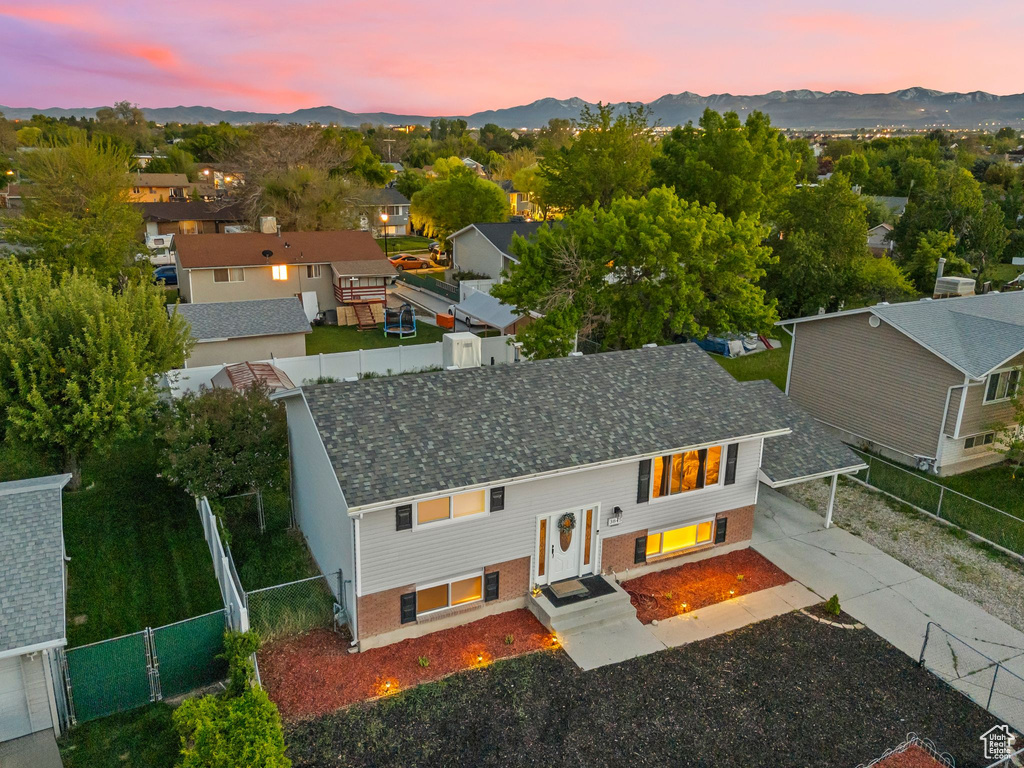 Aerial perspective of suburban area featuring a mountain backdrop
