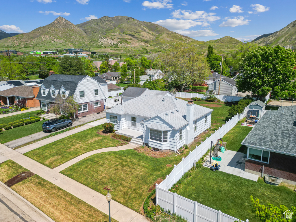 Aerial perspective of suburban area featuring a mountain backdrop