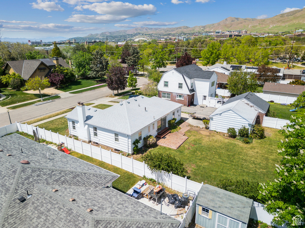 Aerial view of residential area featuring mountains