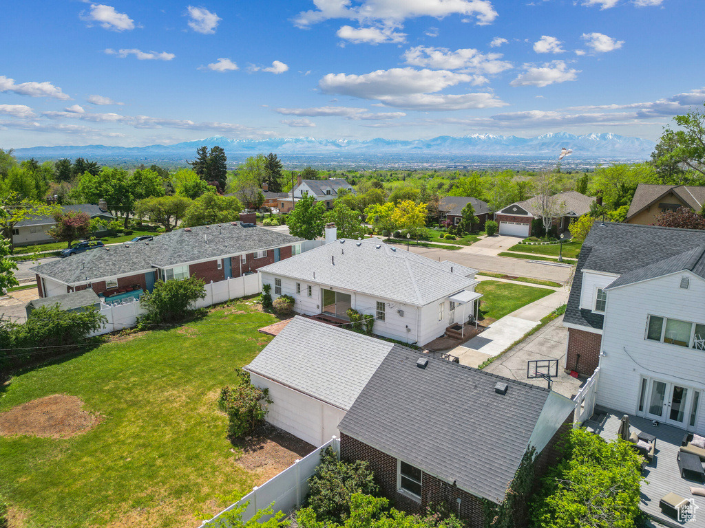 Aerial perspective of suburban area with a mountain backdrop
