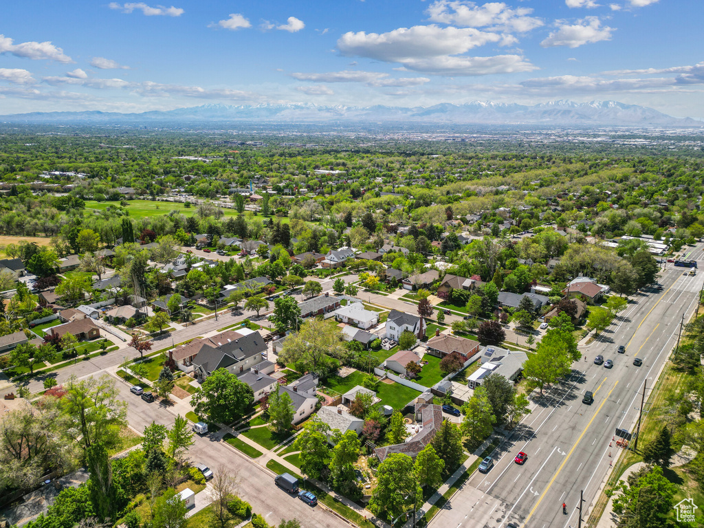Aerial view of a major roadway and a mountain backdrop