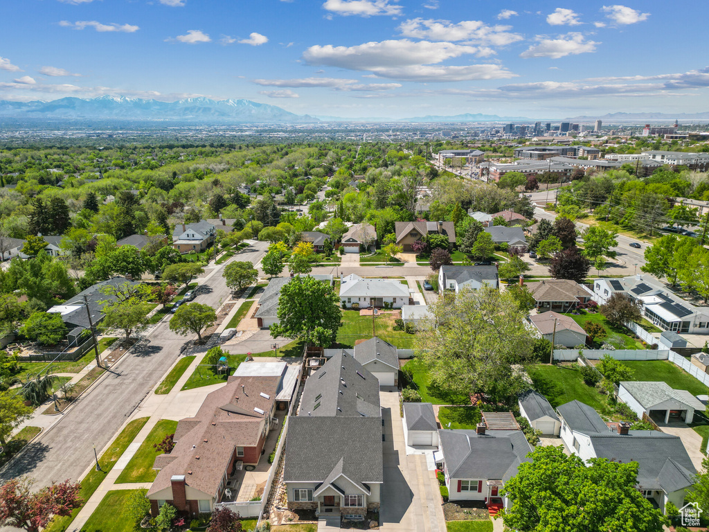 Aerial perspective of suburban area with a mountainous background