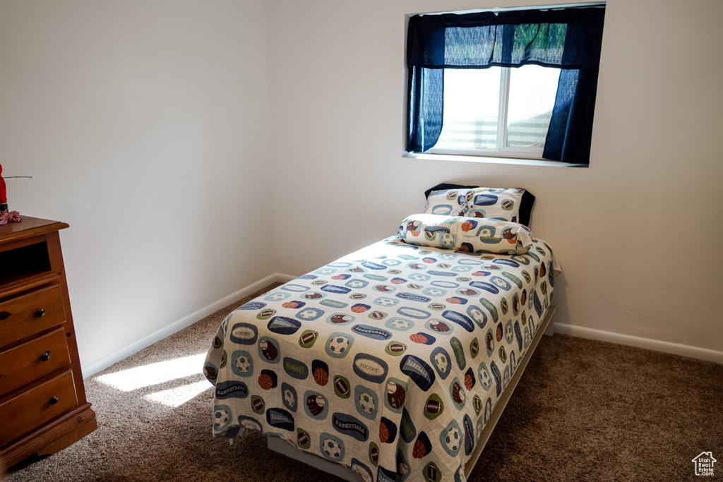 Carpeted bedroom with baseboards