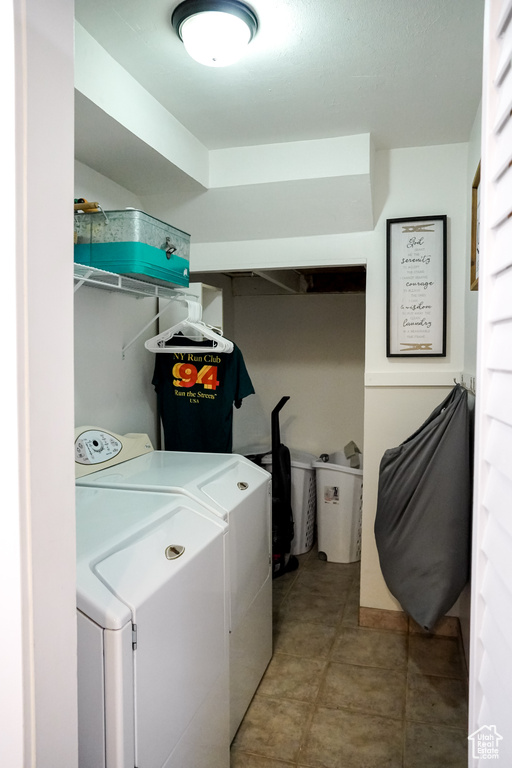 Washroom with washer and clothes dryer