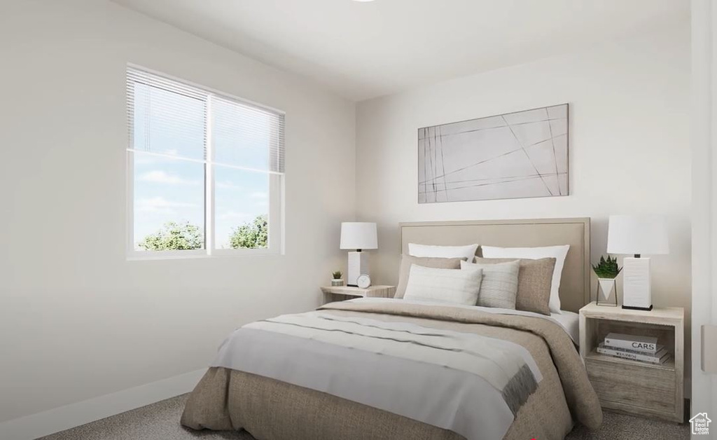Carpeted bedroom featuring baseboards