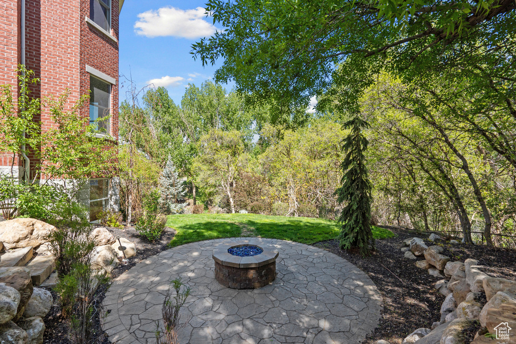 View of patio featuring a fire pit