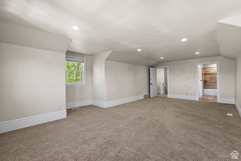 Additional living space featuring carpet, lofted ceiling, recessed lighting, and baseboards