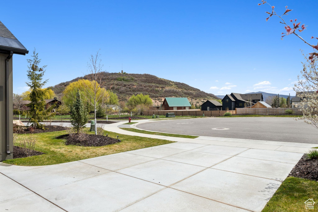 View of yard featuring fence and a mountain view