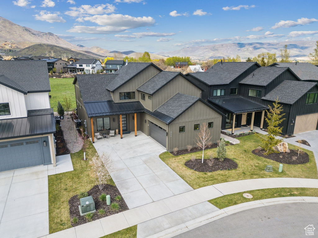 Aerial view of residential area featuring a mountain backdrop