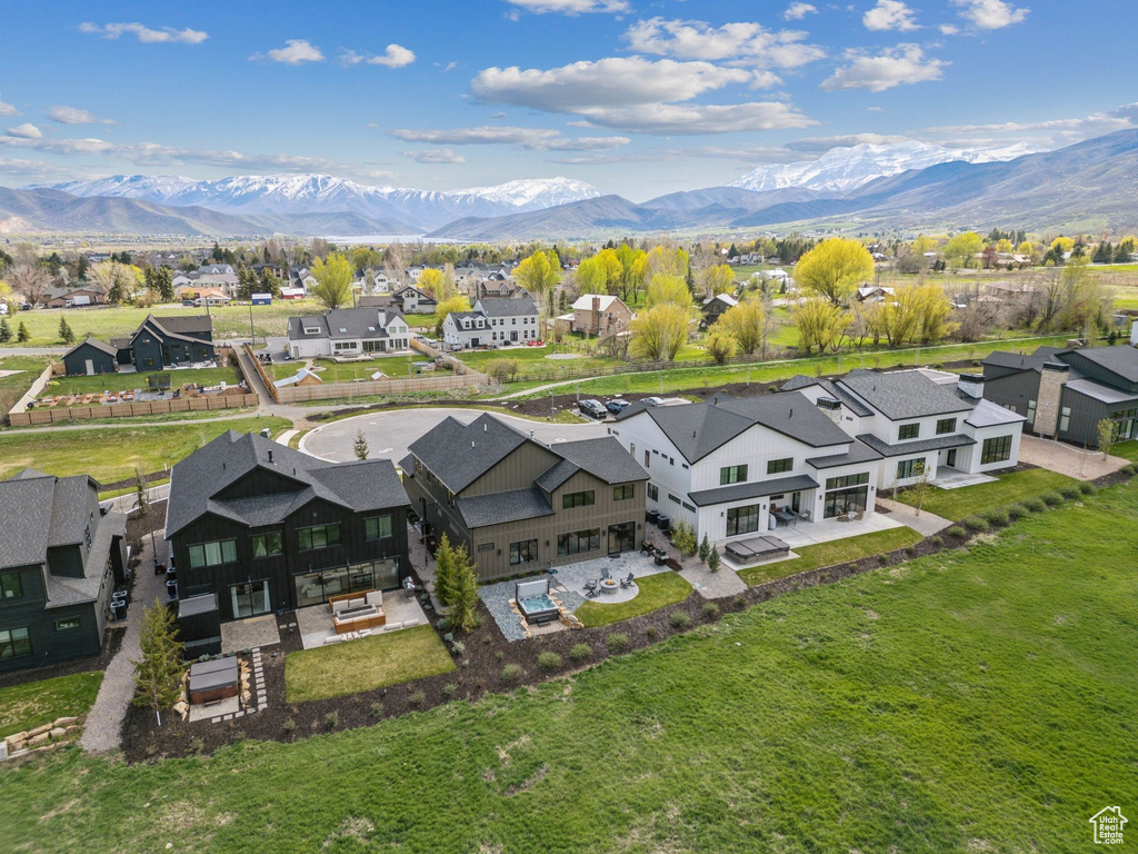 Aerial perspective of suburban area featuring a mountainous background