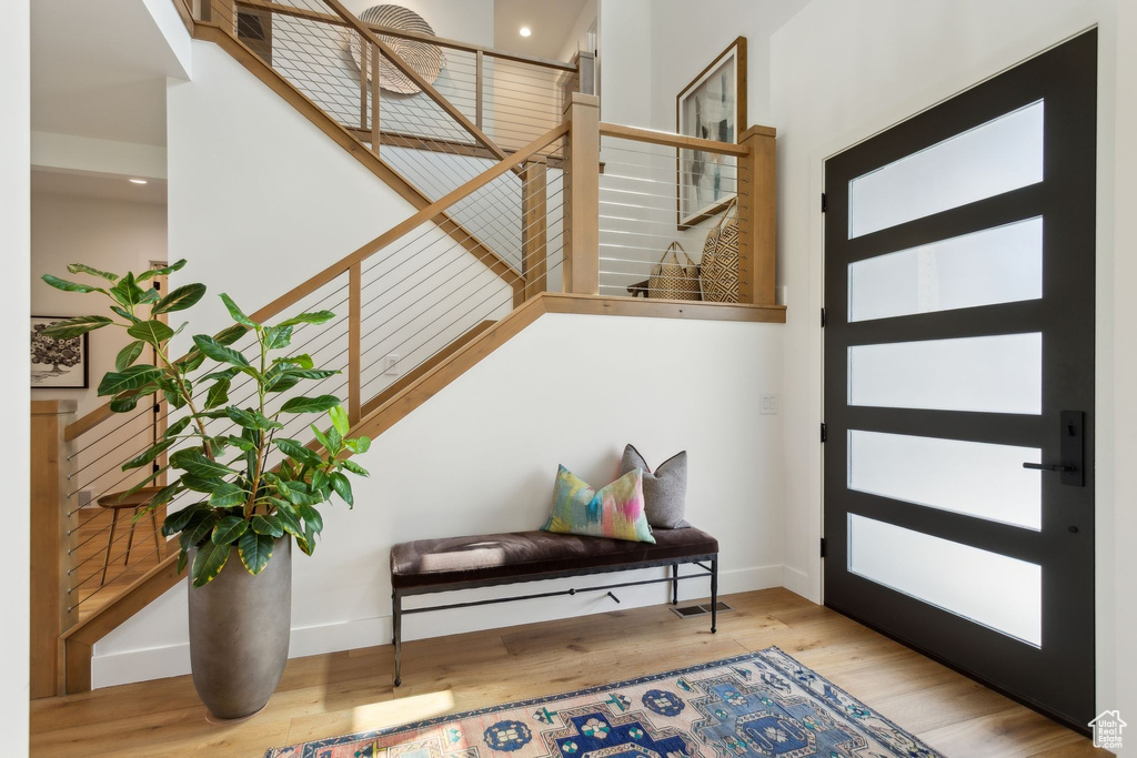 Foyer featuring wood finished floors and baseboards