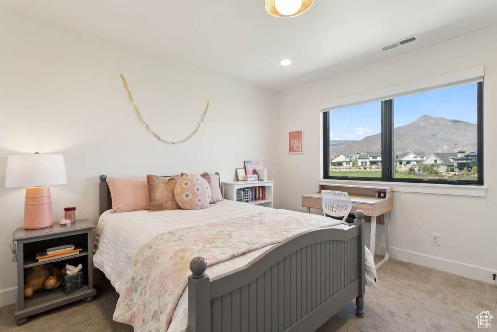 Carpeted bedroom with baseboards, a mountain view, and recessed lighting