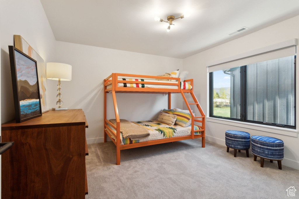 Carpeted bedroom with baseboards