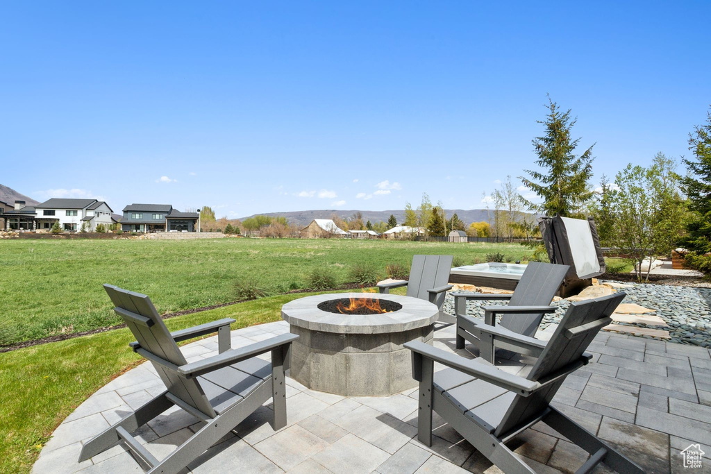 View of patio / terrace featuring an outdoor fire pit