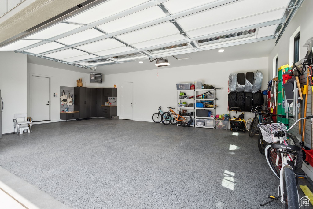Garage featuring a garage door opener