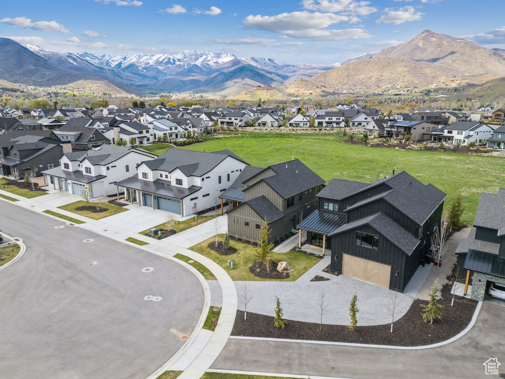 Aerial perspective of suburban area with a mountainous background
