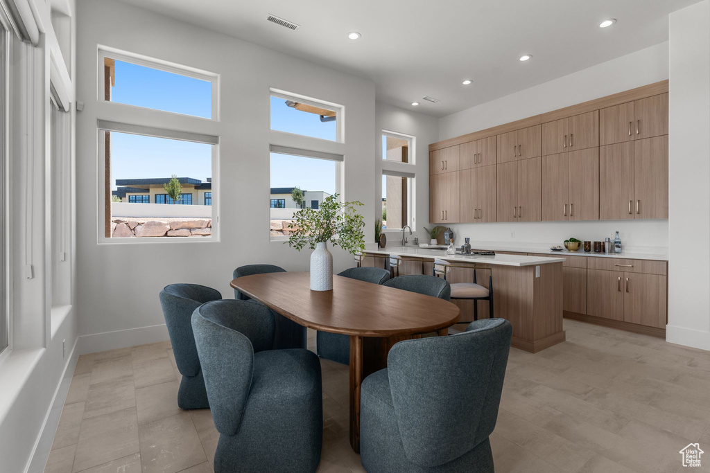 Dining room with recessed lighting and baseboards