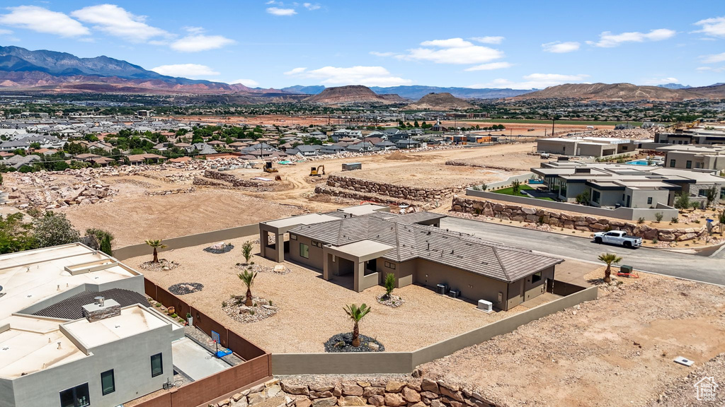 Aerial view of residential area featuring a mountain backdrop