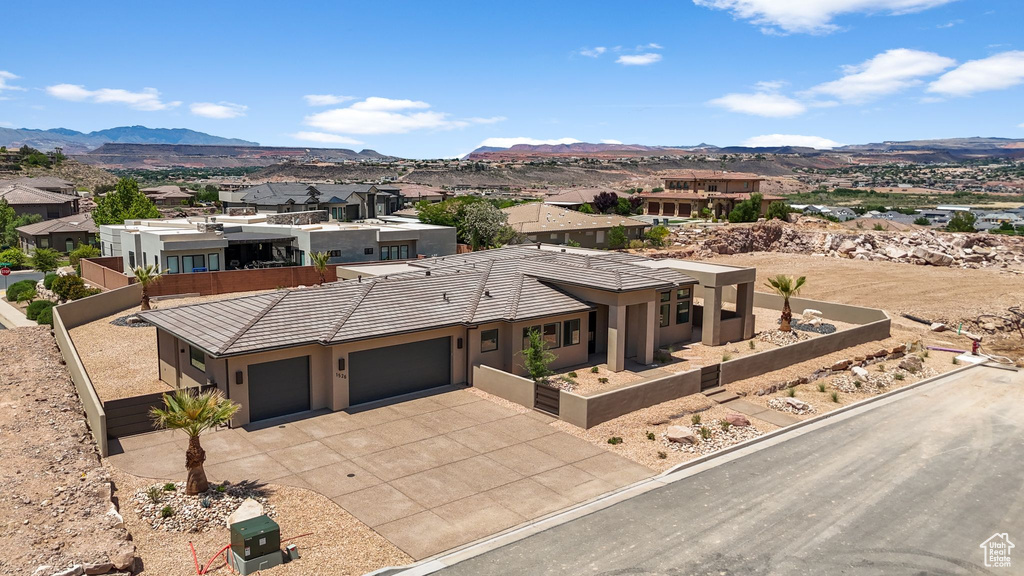 Aerial view of residential area featuring a mountain backdrop