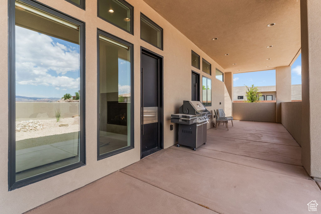 View of patio / terrace featuring area for grilling and a balcony