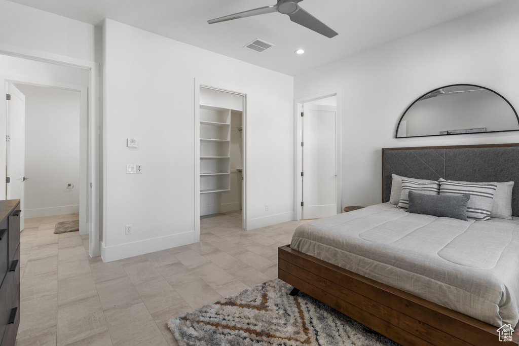 Bedroom featuring baseboards, recessed lighting, a spacious closet, a ceiling fan, and a closet