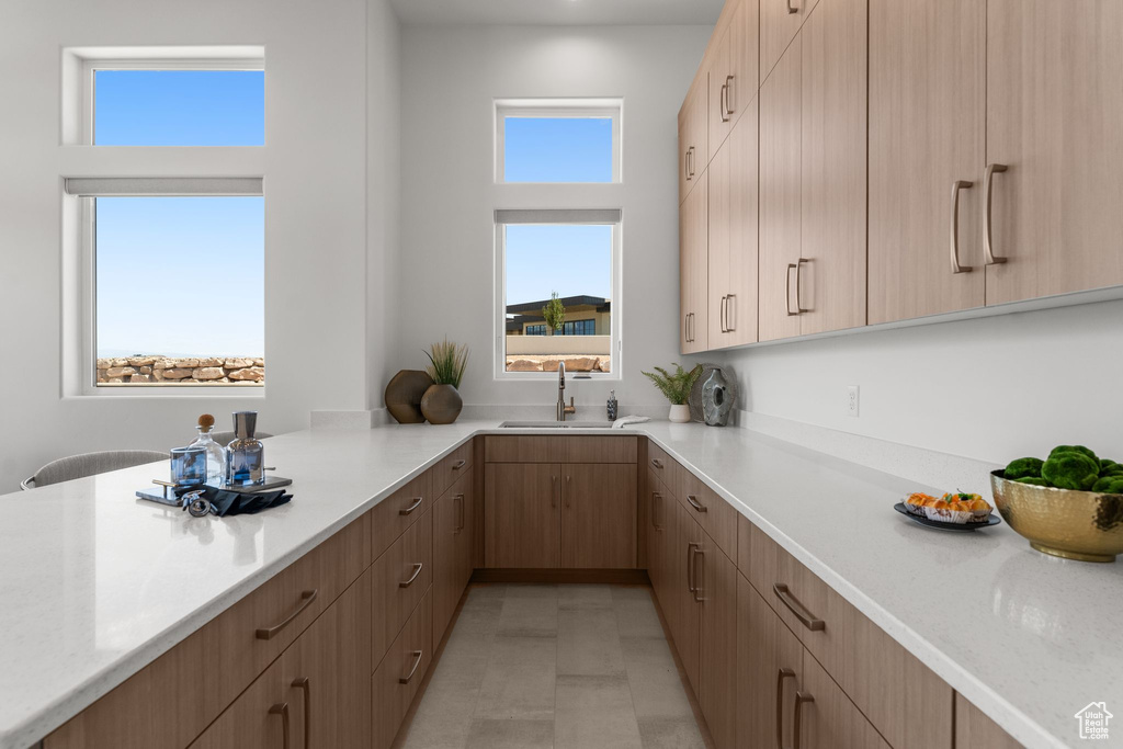 Kitchen featuring a sink and light brown cabinets