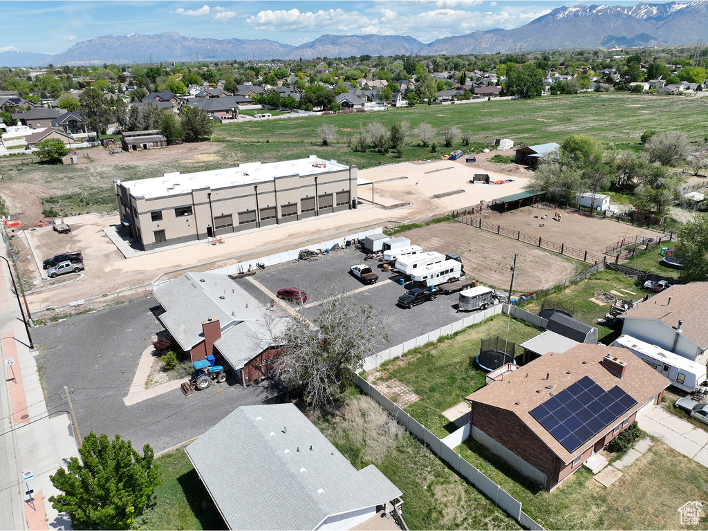 Aerial view of residential area featuring a mountain backdrop