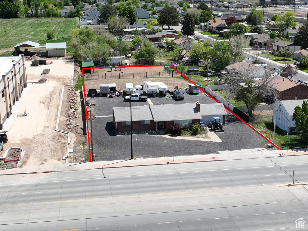 Aerial perspective of suburban area featuring property parcel outlined