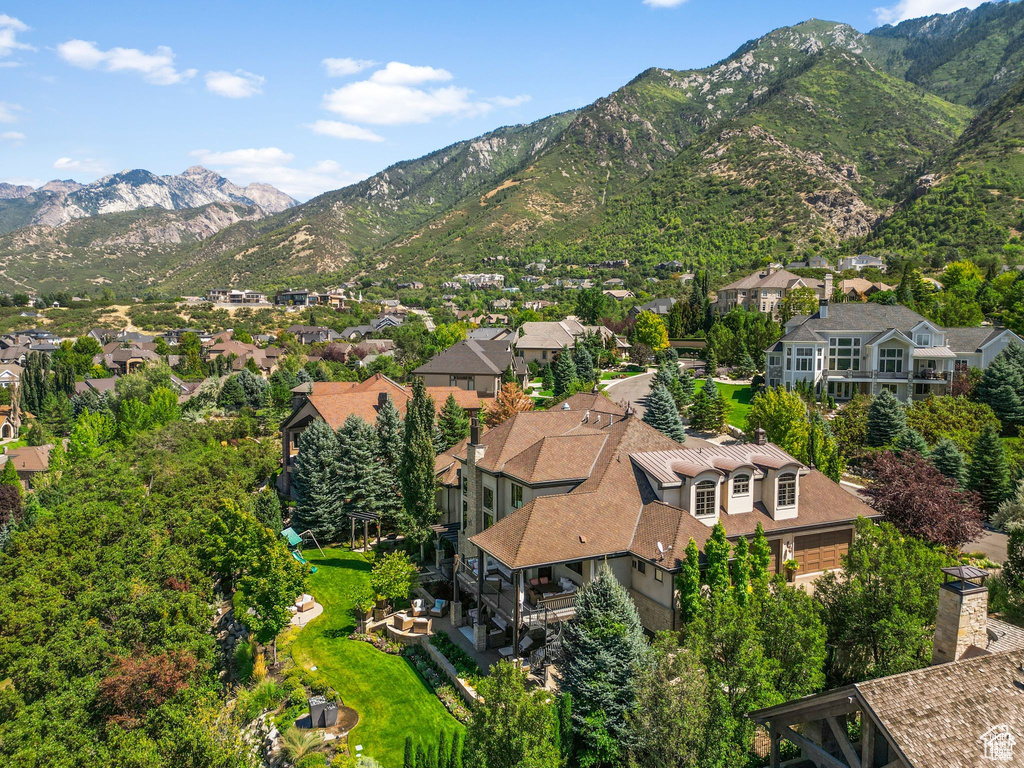 Birds eye view of property with a residential view and a mountain view