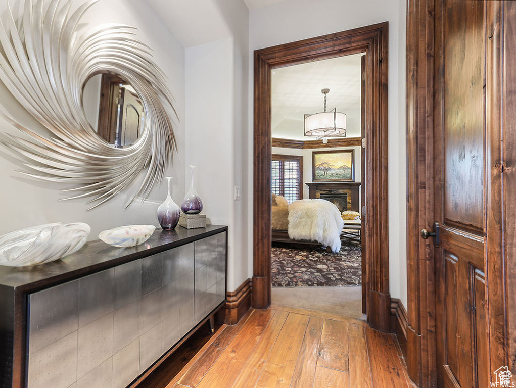 Hallway featuring baseboards and wood-type flooring