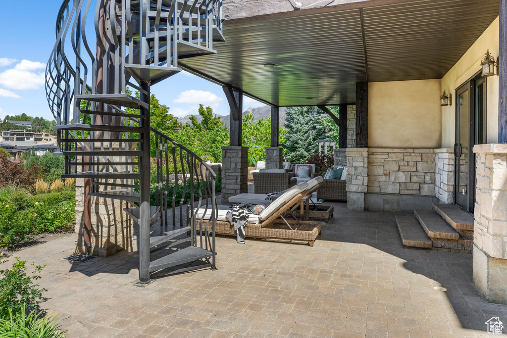 View of patio featuring stairs