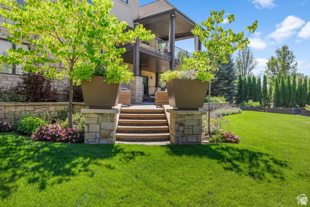 Exterior space featuring a balcony and covered porch