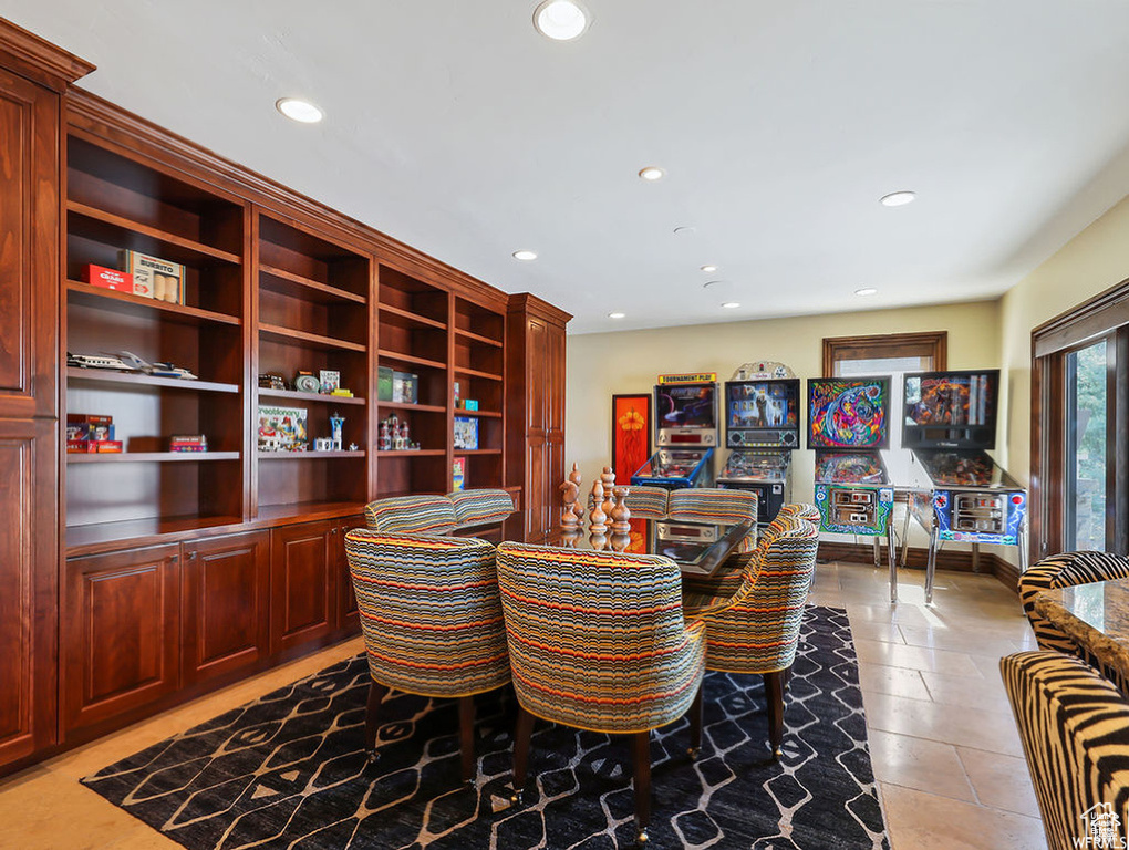 Dining area featuring recessed lighting and light tile patterned floors