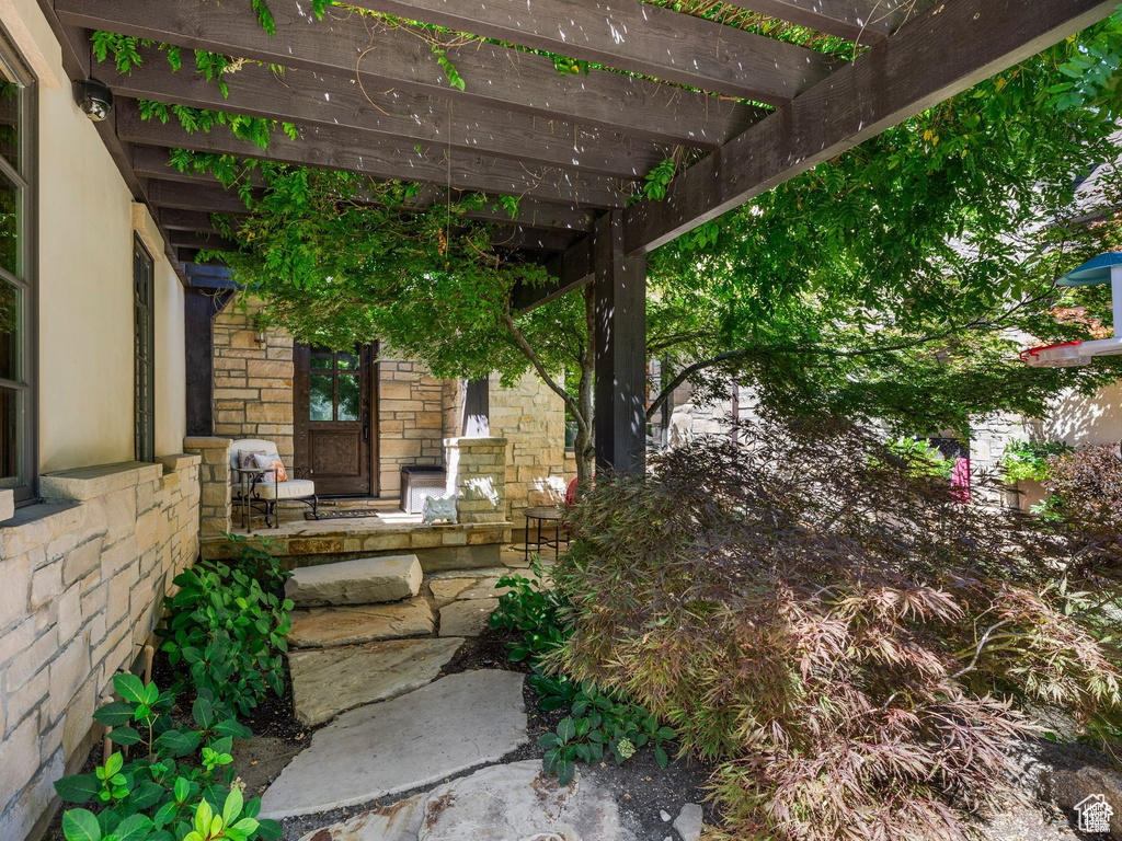 View of patio / terrace featuring a pergola and covered porch