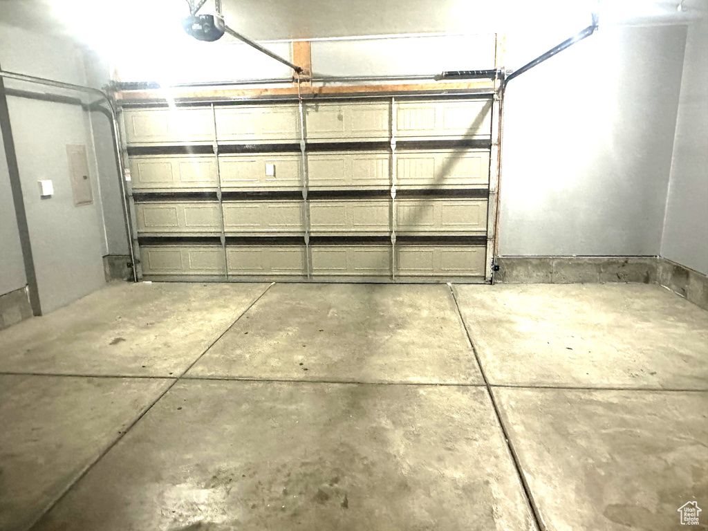 Garage with a garage door opener and electric panel