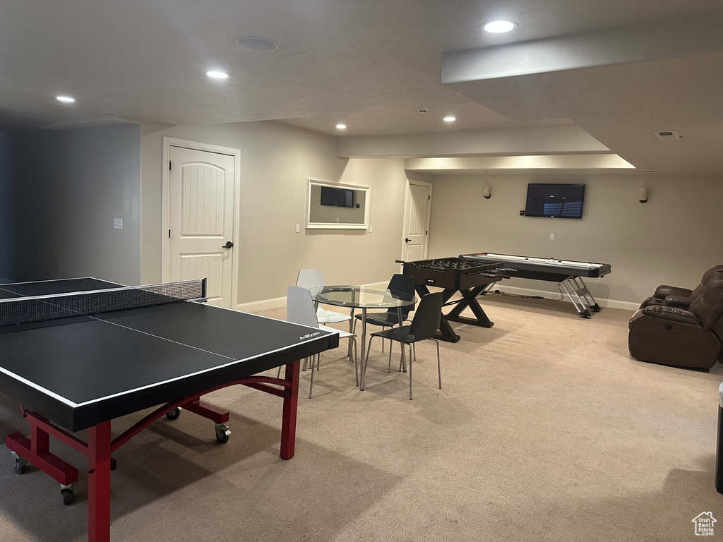 Game room with baseboards, light colored carpet, and recessed lighting