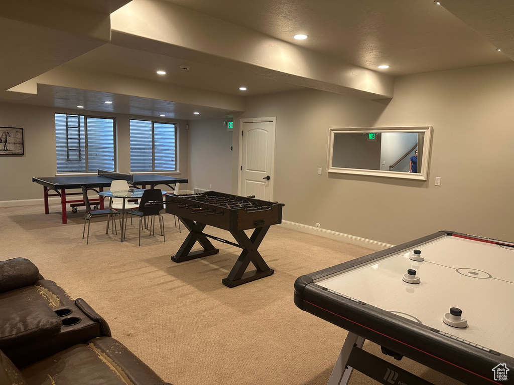 Rec room featuring light carpet, baseboards, and recessed lighting