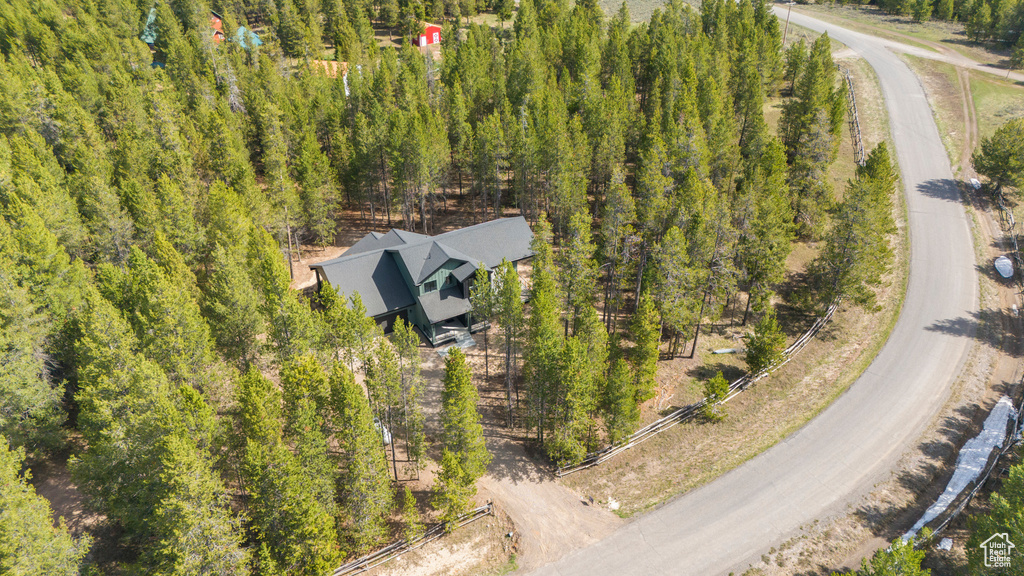 Aerial overview of property's location with a forest